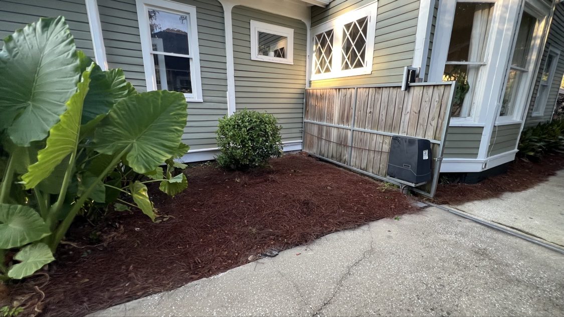Corner garden bed with pine straw colorant