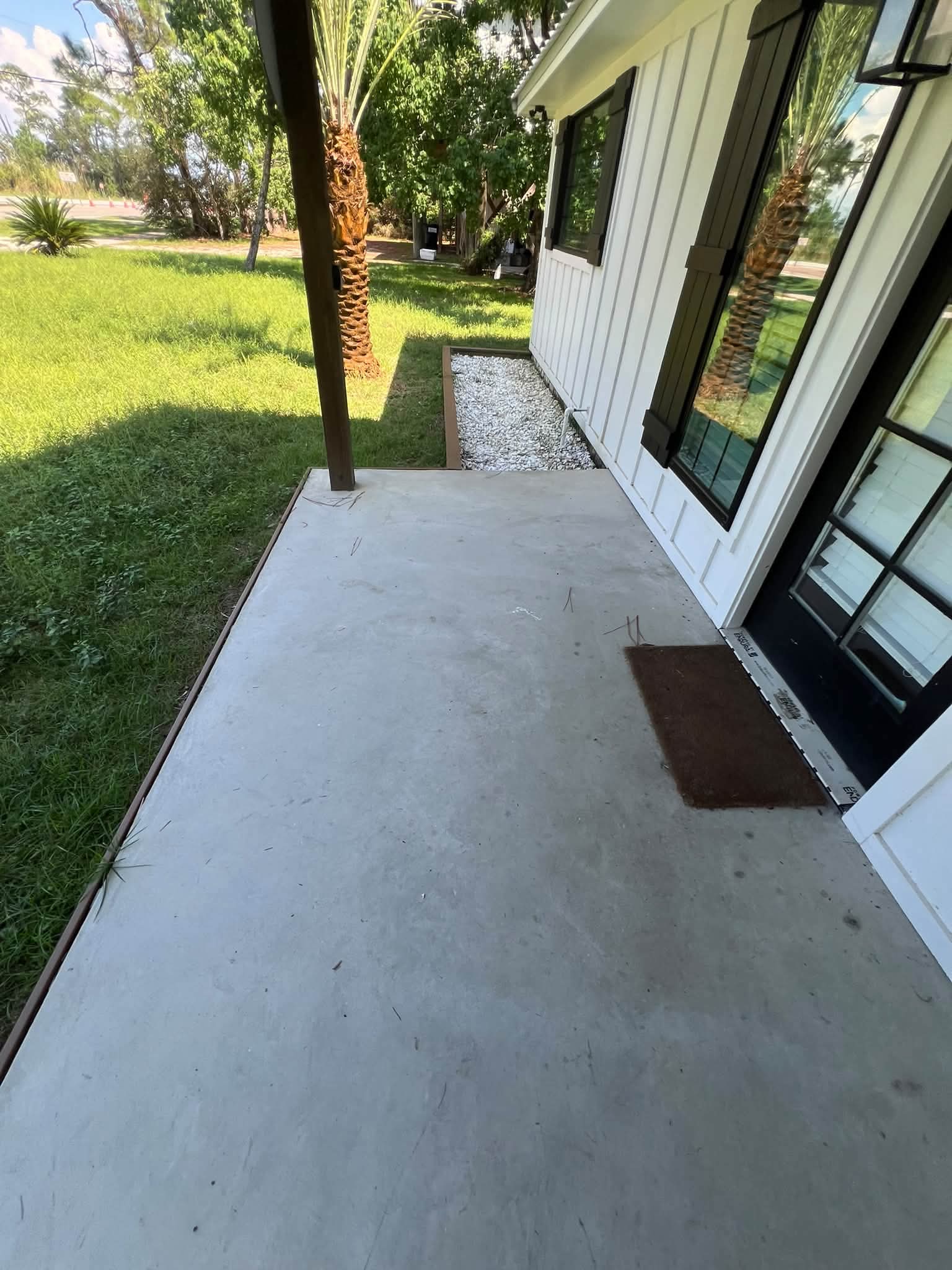 Concrete porch and walkway after pressure washing