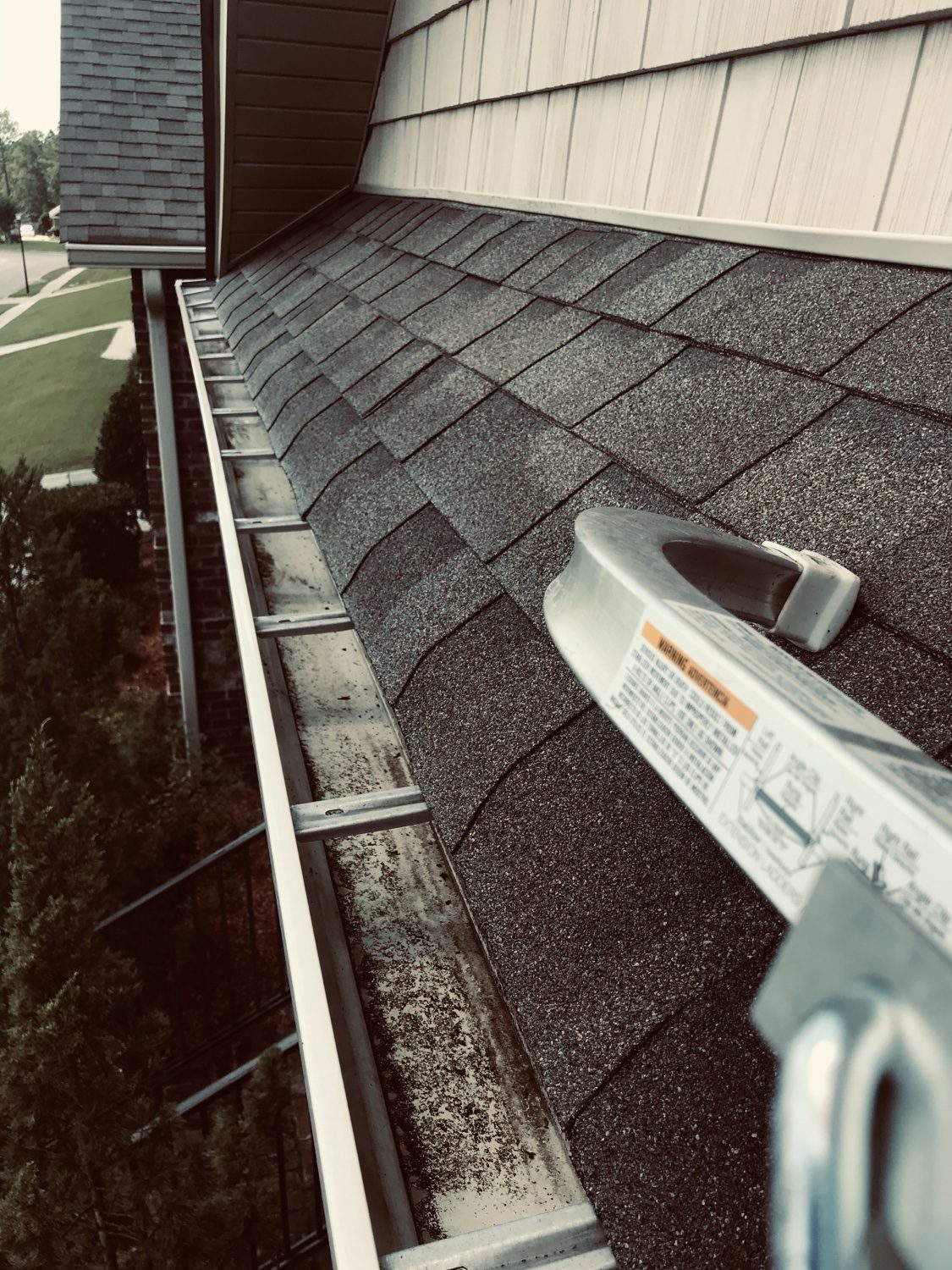 Clean gutter along the roofline after service